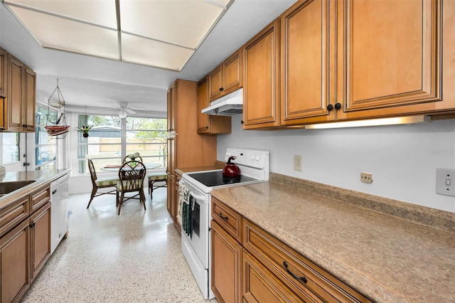 kitchen featuring ceiling fan, sink, and white appliances