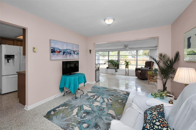 living room featuring ceiling fan