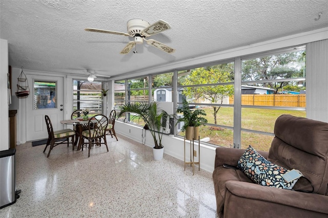 sunroom / solarium with ceiling fan