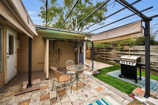 view of patio / terrace with a pergola and area for grilling