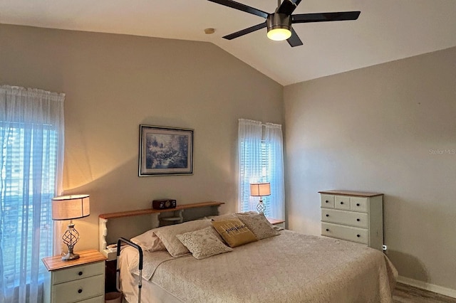 bedroom featuring hardwood / wood-style floors, vaulted ceiling, and ceiling fan