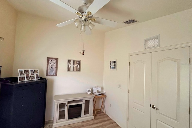 interior space with ceiling fan and light hardwood / wood-style flooring