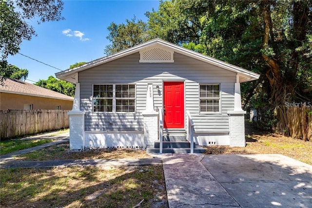 bungalow-style house featuring a patio