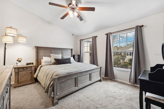 carpeted bedroom featuring vaulted ceiling and ceiling fan