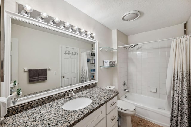 full bathroom with toilet, tile patterned flooring, shower / bath combination with curtain, a textured ceiling, and vanity