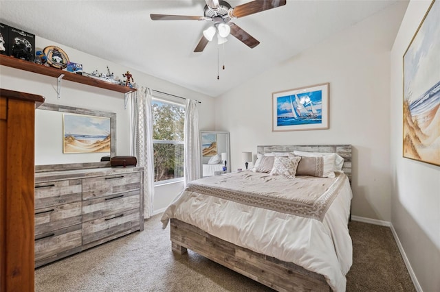 carpeted bedroom with ceiling fan and vaulted ceiling