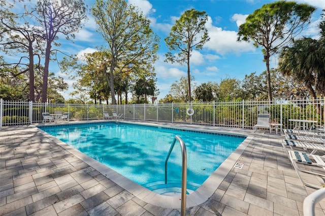 view of swimming pool featuring a patio area