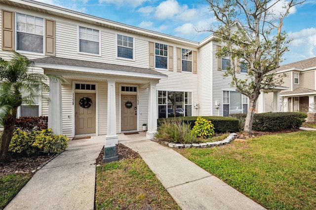 view of property with a front lawn