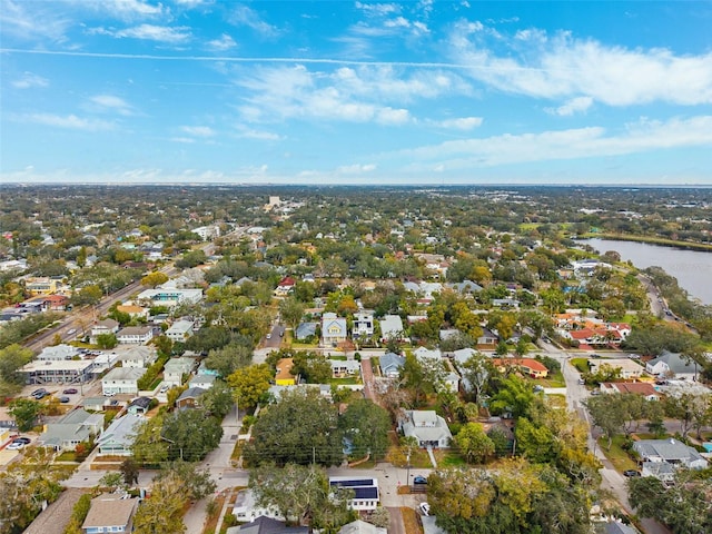 drone / aerial view featuring a residential view and a water view