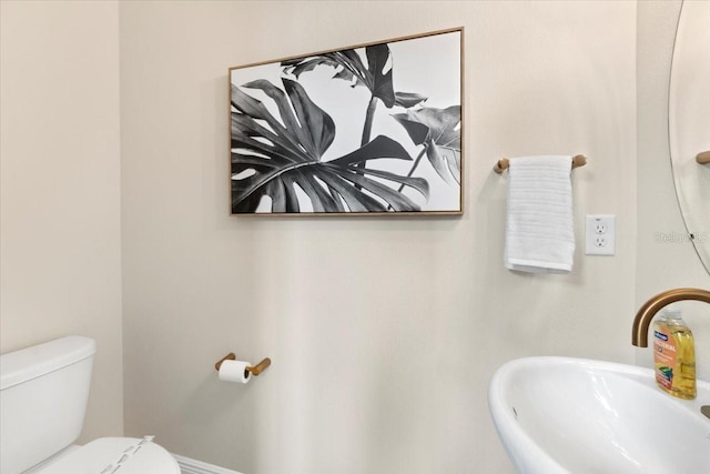 bathroom with sink and toilet