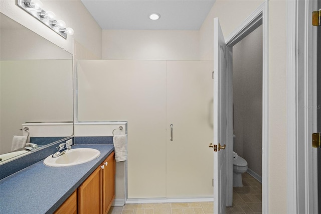 bathroom featuring toilet and vanity