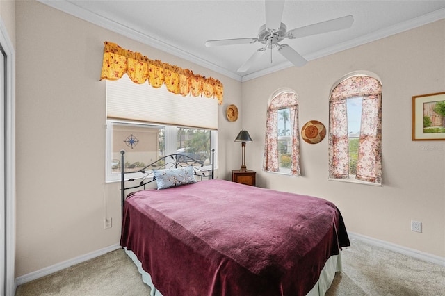 bedroom with ceiling fan, carpet, and ornamental molding