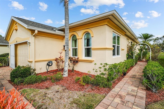 view of property exterior featuring a garage