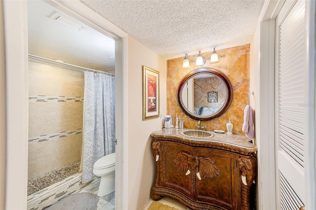 bathroom with a shower with shower curtain, toilet, a textured ceiling, and vanity