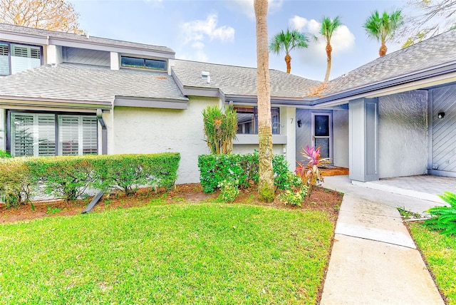 property entrance with a yard