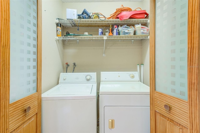 laundry room featuring washing machine and dryer