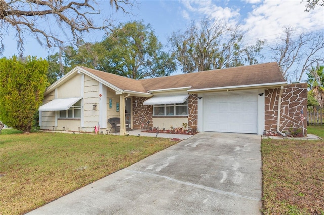 ranch-style home with a front yard and a garage