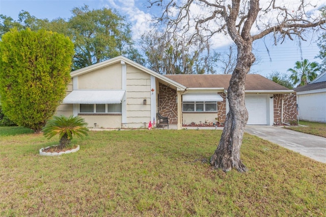 ranch-style home featuring a front lawn and a garage