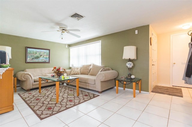 living room with ceiling fan and light tile patterned floors