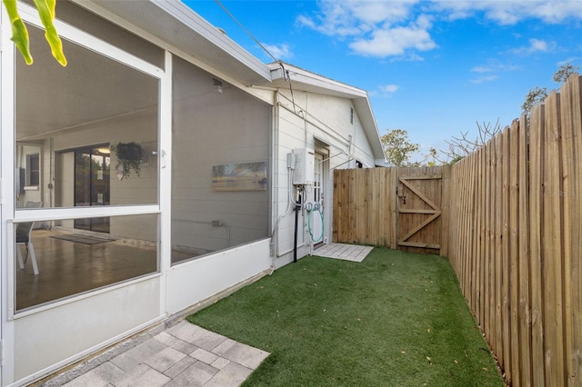 view of yard with a sunroom