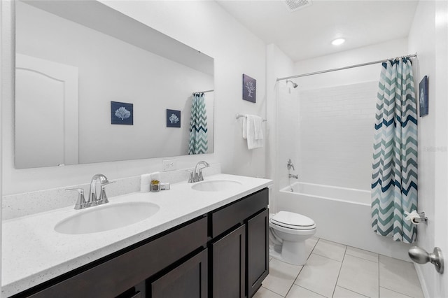 full bathroom with toilet, vanity, tile patterned flooring, and shower / bath combo