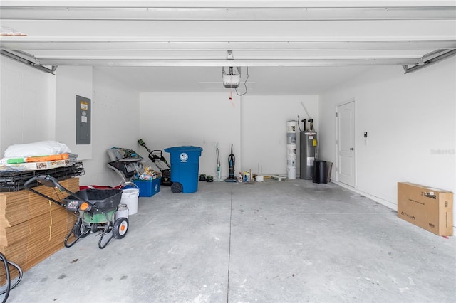 garage with a garage door opener, electric panel, and electric water heater