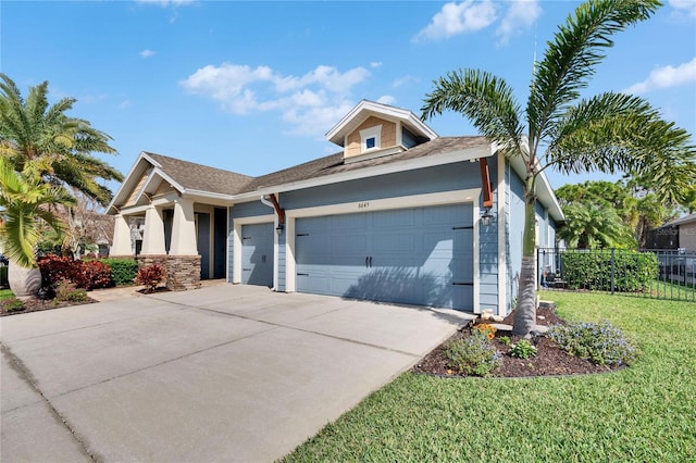 view of front of property featuring a garage and a front yard