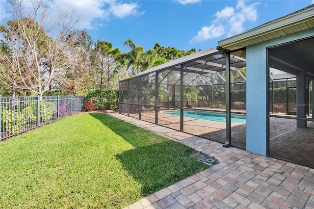 view of swimming pool featuring a yard and a patio