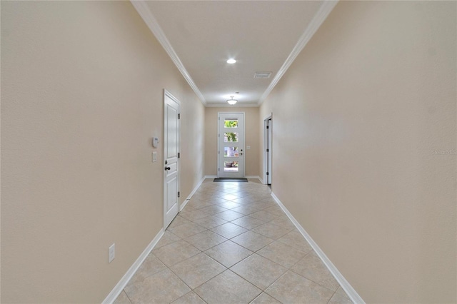 entryway featuring light tile patterned floors and ornamental molding