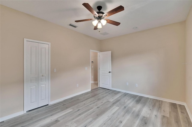 unfurnished room featuring ceiling fan and light wood-type flooring