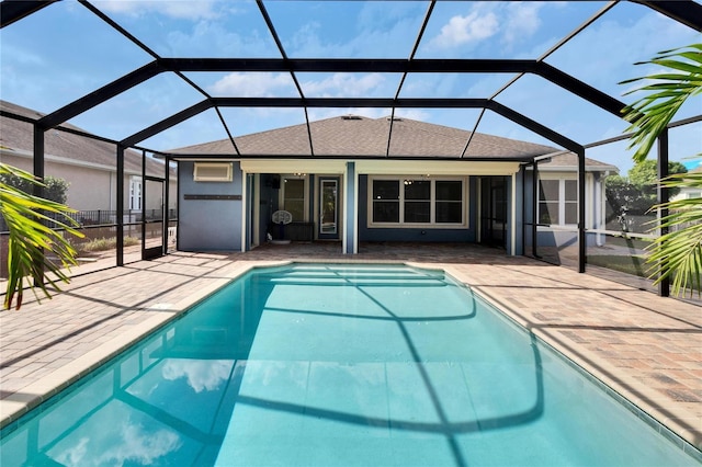 view of swimming pool featuring a lanai and a patio area