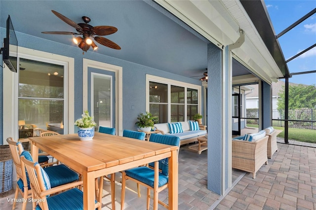 sunroom / solarium with ceiling fan