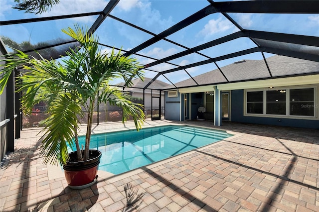 view of pool with a lanai and a patio area