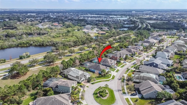 birds eye view of property with a water view