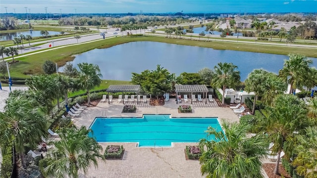 view of pool with a gazebo, a water view, a pergola, and a patio area