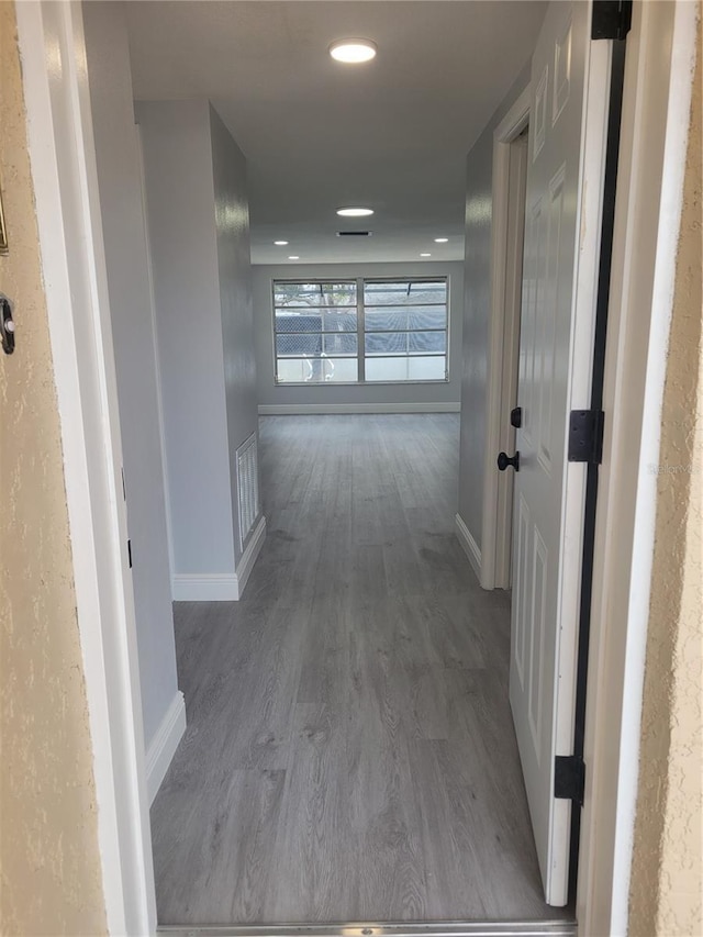 hallway featuring wood-type flooring