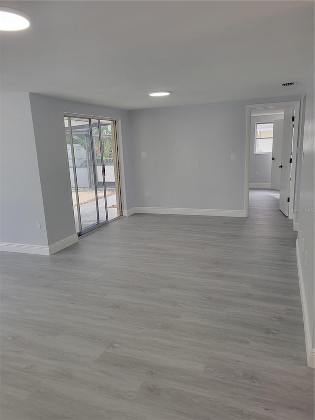 unfurnished room featuring light wood-type flooring