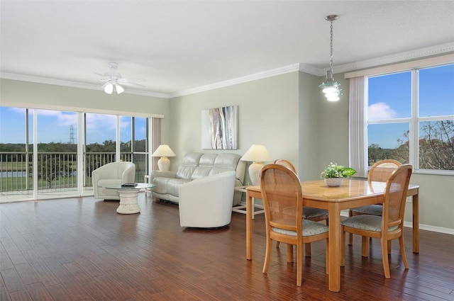 dining area featuring crown molding and a healthy amount of sunlight