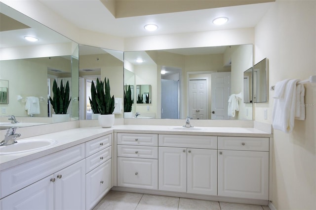 bathroom with vanity, tile patterned floors, and walk in shower