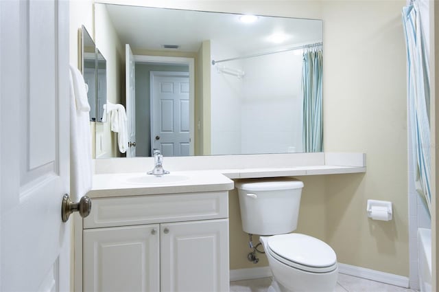 bathroom featuring vanity, tile patterned floors, and toilet