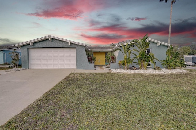 view of front of house featuring a garage, a lawn, and central air condition unit