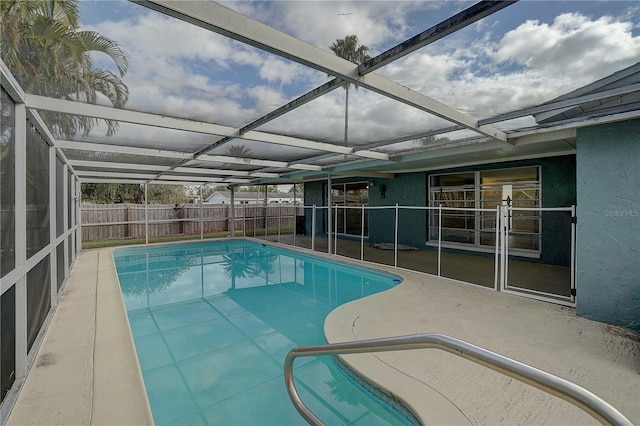 view of pool featuring a lanai and a patio