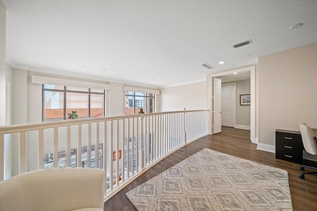 hall featuring dark hardwood / wood-style flooring and ornamental molding