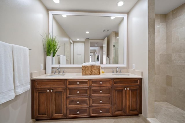 bathroom featuring vanity and a tile shower