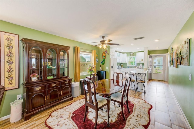 dining space featuring ceiling fan