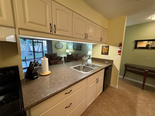 kitchen featuring sink, white cabinets, range, and dishwasher