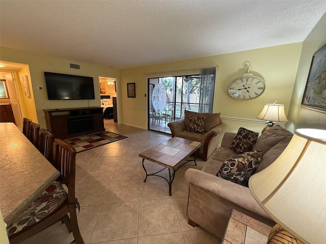 tiled living room with a textured ceiling