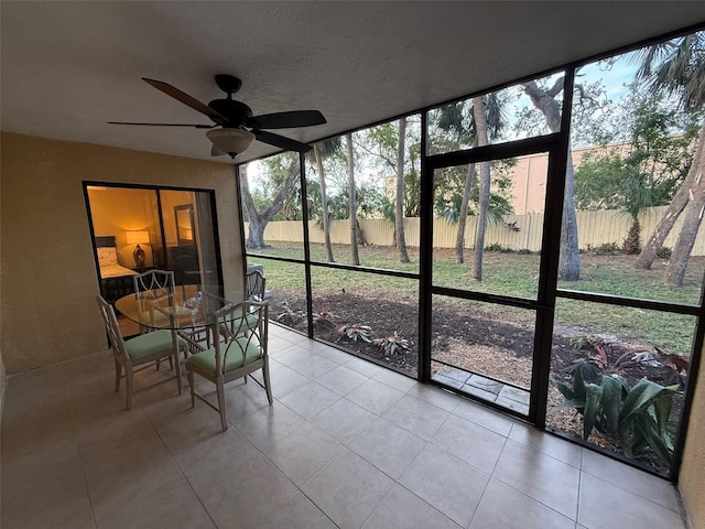 sunroom with ceiling fan and plenty of natural light