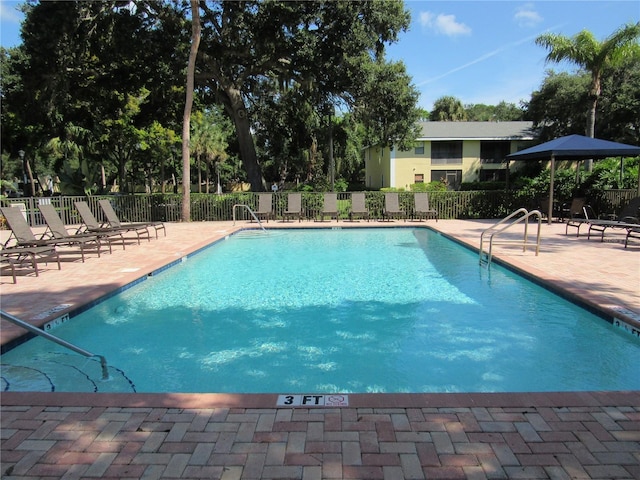 view of swimming pool featuring a patio