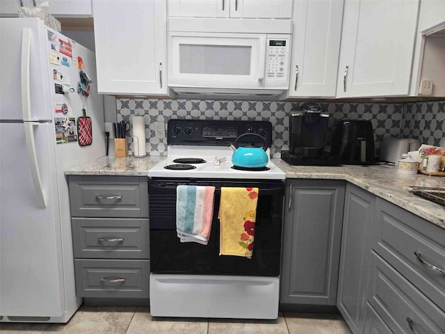 kitchen featuring decorative backsplash, white appliances, white cabinets, and gray cabinetry